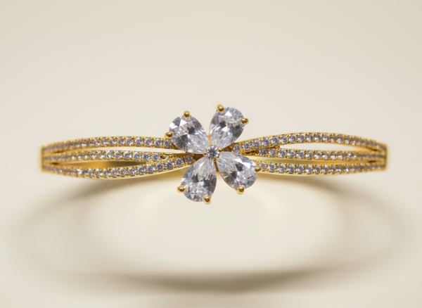 Gold-Plated Bangle-Style Bracelet With Diamond Stones in a Floral Pattern