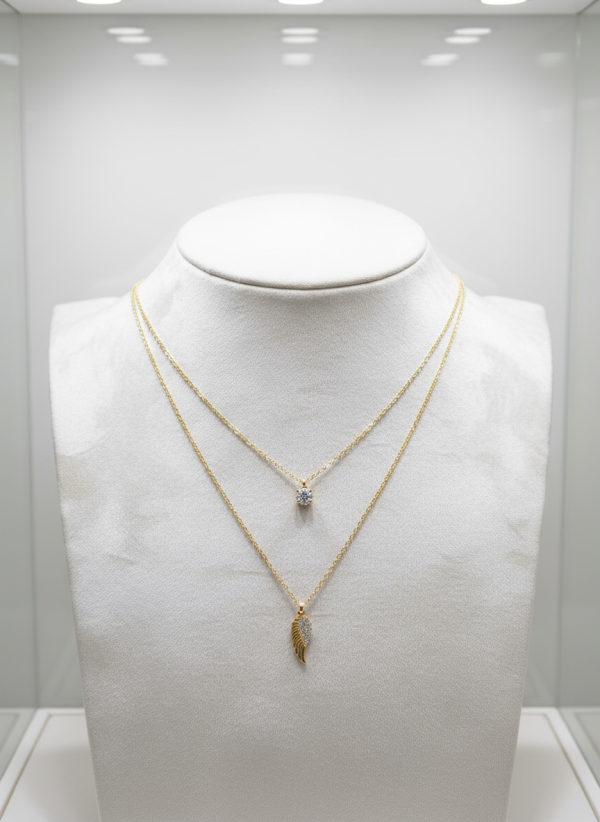 Gold-Plated Layered Necklace With a Rhinestone Solitaire And An Angel Wing Pendant